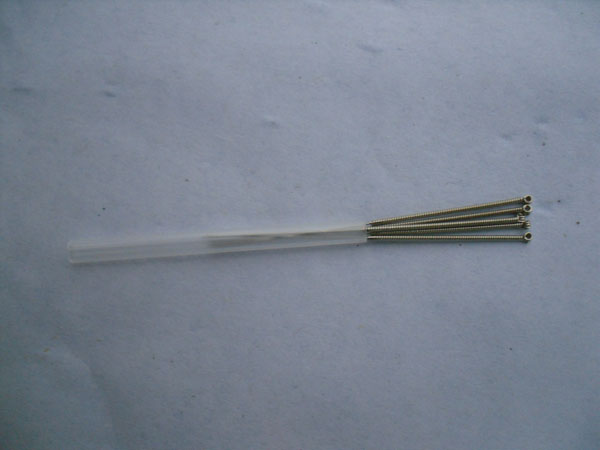 Plastic tube with five nickel handle needles